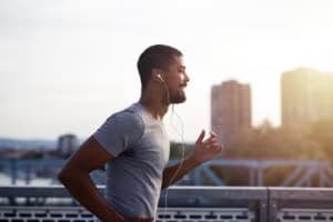 sportsman-with-earphones-running-enjoying-402881