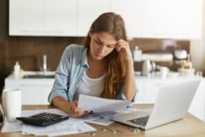 young-woman-checking-her-budget-doing-taxes-853782